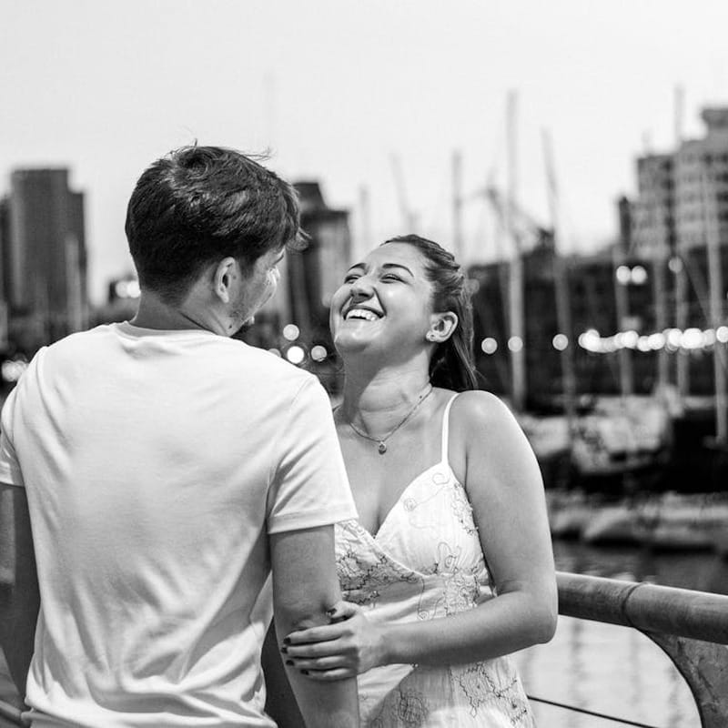 Happy couple laughing together having fun on a date